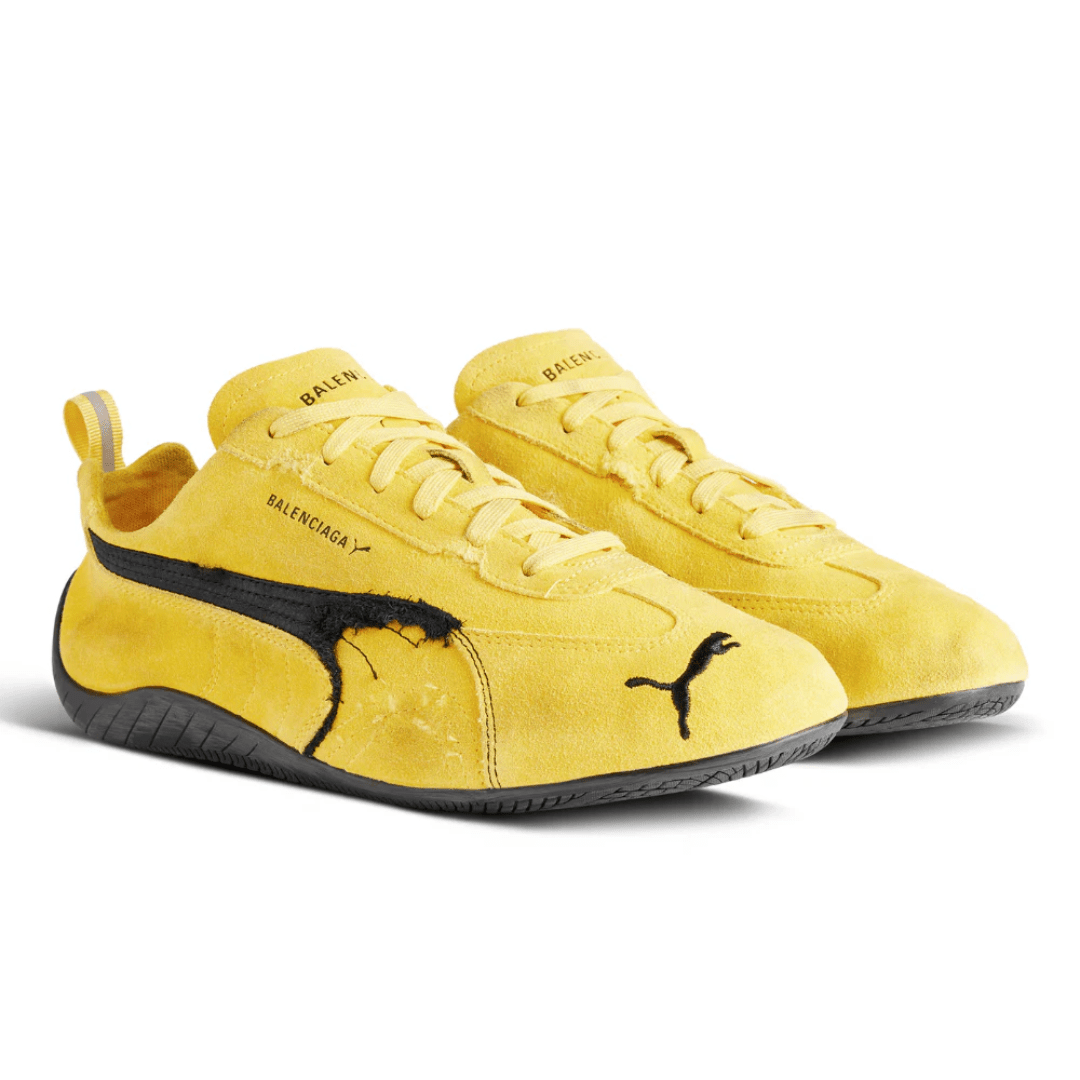 Balenciaga x Puma Speedcat Suede Yellow Black sneakers on feet Dubai