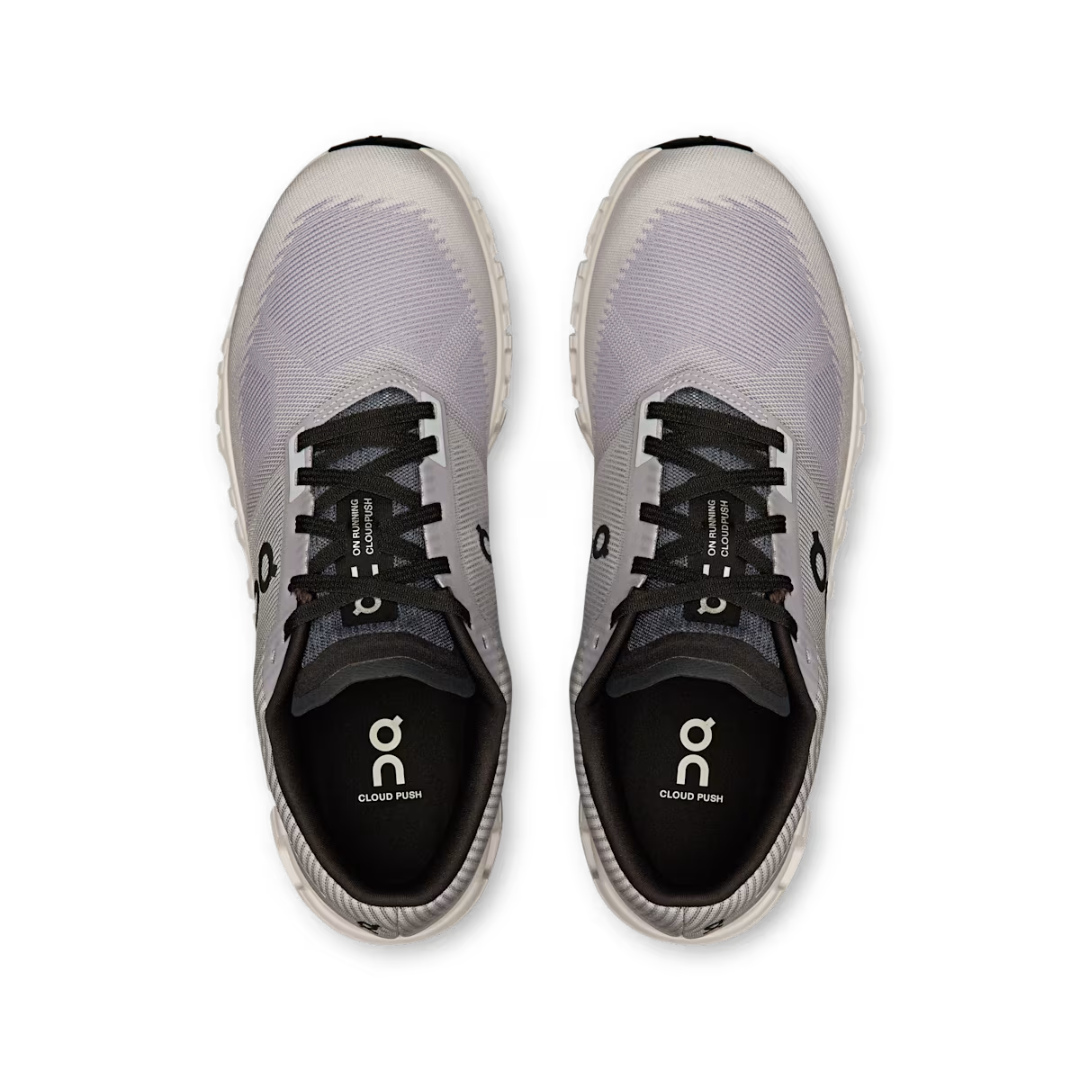 Gray running shoes with black soles on a white background