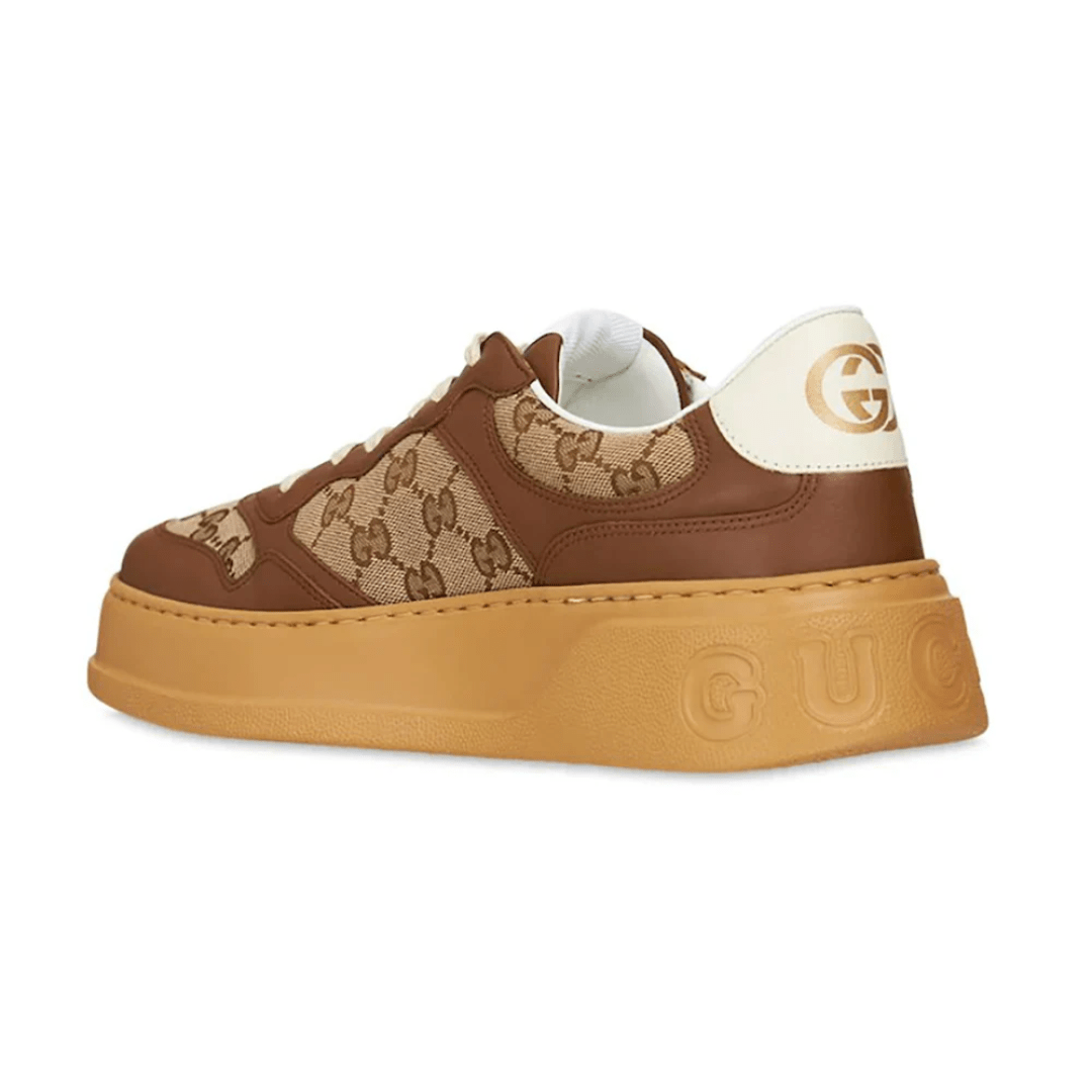 Gucci GG Canvas Leather-Trimmed Sneakers on feet Dubai